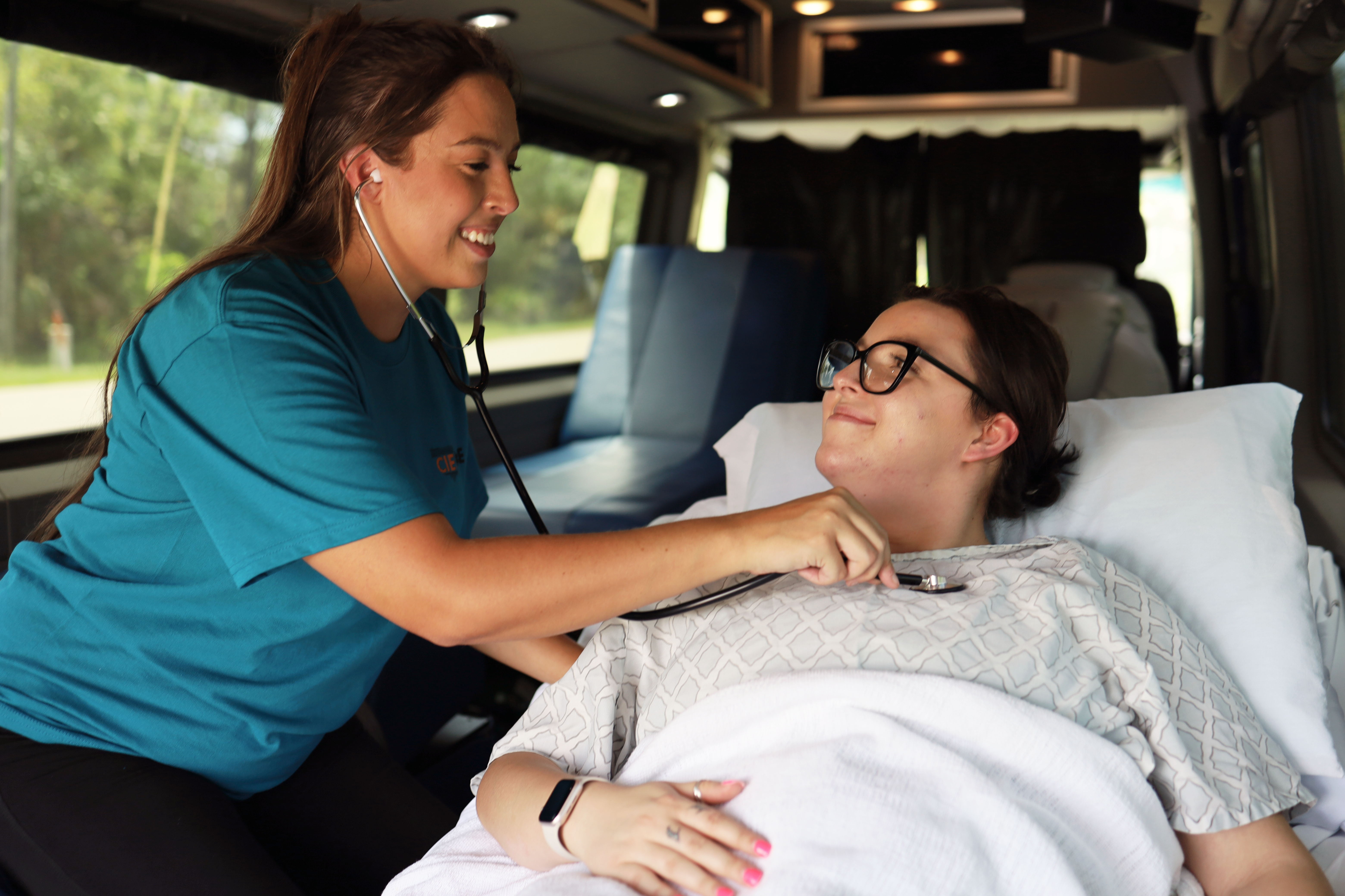 Nurse With Patient On Long Distance Transport
